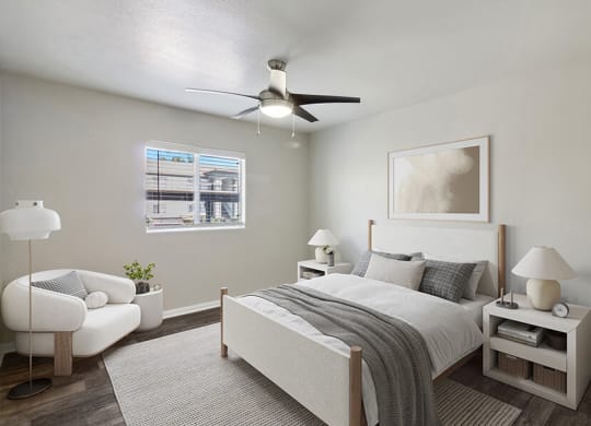 Model Bedroom with Wood-Style Flooring and Window View at Loma Vista Apartments in Las Vegas, NV.