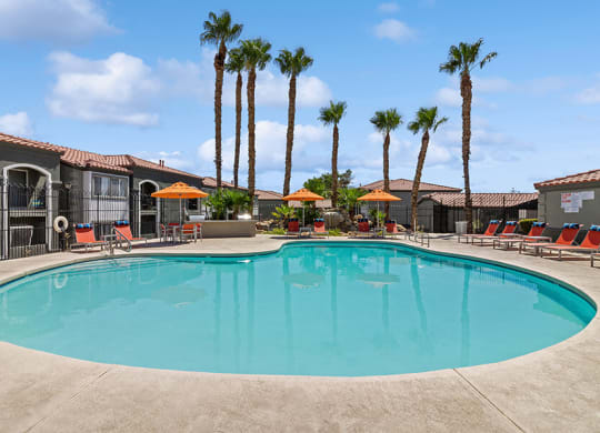 Community Swimming Pool with Pool Furniture at Loma Vista Apartments in Las Vegas, NV.