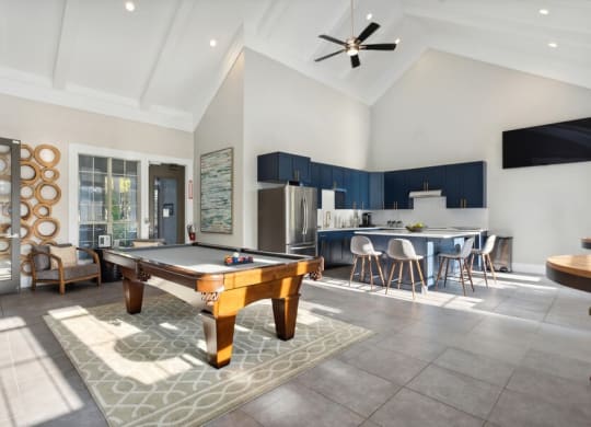 Clubhouse Pool Table and Kitchen at Caribbean Breeze Apartments in Tampa, FL.