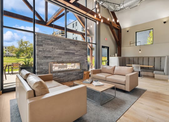Community Clubhouse with Lounge Furniture and Fireplace at Elevate on Parkway Apartments, Burnsville