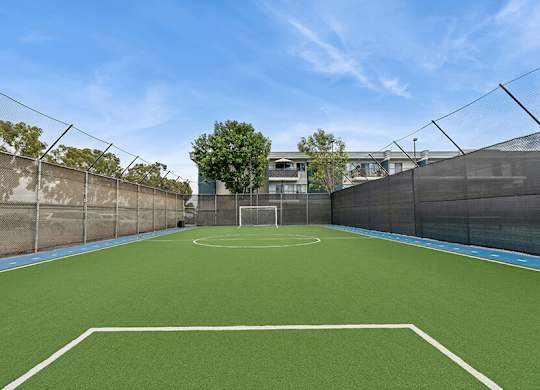 Community Soccer Field with Nets at Madison Park Apartments located in Anaheim, CA.