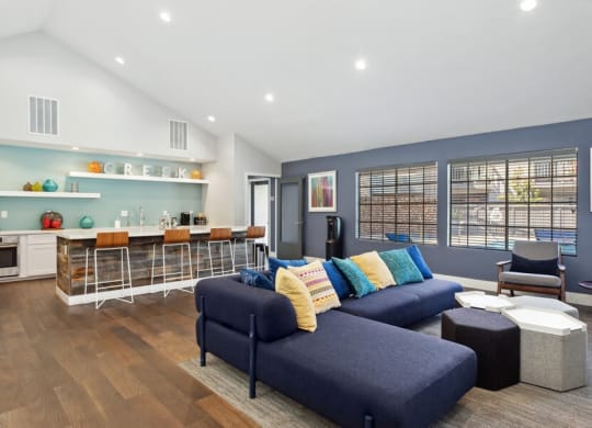 Community Clubhouse with Island Bar and Lounge Furniture at Creek 2645 Apartments in Sacramento, CA.