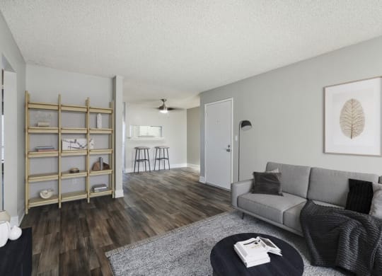 Model living room with view of kitchen bar