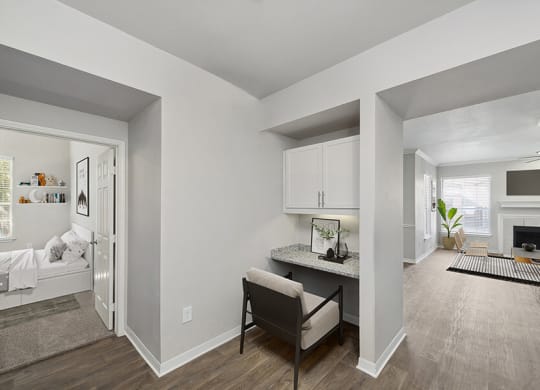 Model Office Area with Wood-Style Flooring and Built in Desk at Chapel Hill Apartments in Lewisville, TX.