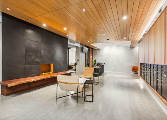 Community lobby with fireplace and mailboxes at TL Residences