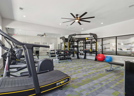 Community Fitness Center with Equipment at Retreat at Stonecrest Apartments located in Lithonia, GA.