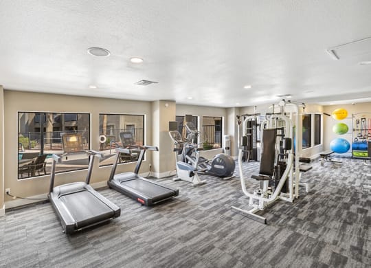 Community Fitness Center with Equipment at Saddle Ridge Apartments in Tucson, AZ.