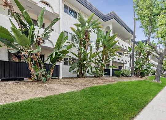 Exterior Community Building and Landscape at Palmilla Apartments located in San Diego, CA.