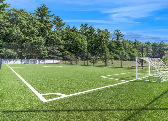 Community Soccer Field with Nets at Village at Marshfield Apartments located in Marshfield, MA.