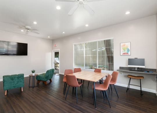 Community Clubhouse with Lounge Furniture & Work Stations at Indigo Park Apartments located in Albuquerque, NM.