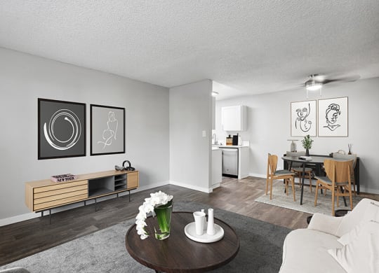 Model Living Room with Carpet and Wood-Style Flooring at The Archer Apartments in Sacramento, CA.