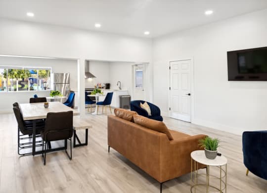 Resident clubhouse with a couch chairs and a table at Lakeside Casitas in Tucson, AZ