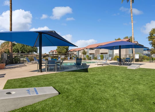 Outdoor Corn Hole Area at Peaks on 4th Apartments in Avondale, AZ.