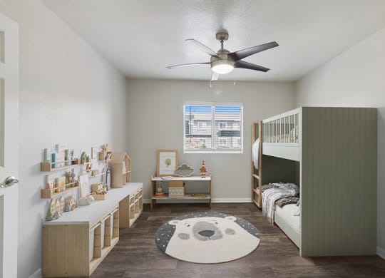 Model Bedroom with Wood-Style Flooring and Window View at Loma Vista Apartments in Las Vegas, NV.