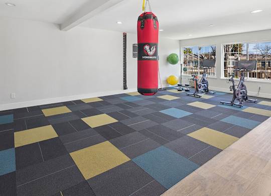 Community Fitness Center with Equipment at Los Gatos Landing Apartments located in San Jose, CA.
