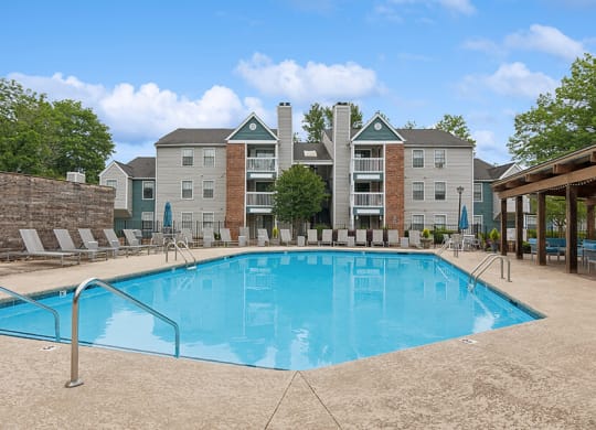 Community Swimming Pool with Pool Furniture at Park 2300 Apartments in Charlotte, NC.