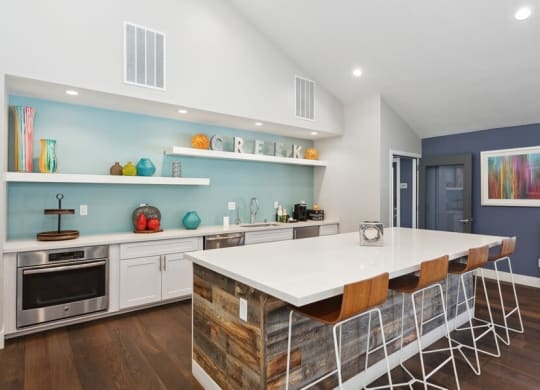 Community Clubhouse with Kitchen Area and Island at Creek 2645 Apartments in Sacramento, CA.