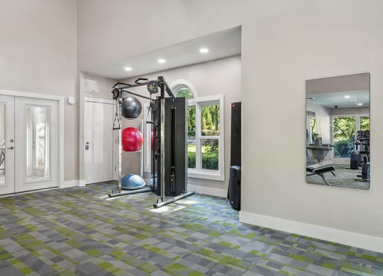 Community Fitness Center with Equipment at Lakeside Retreat Apartments located in Peachtree Corners, GA.