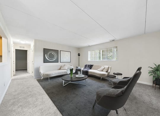 Model Living Room with Carpet and Hallway View at Heights Marlborough Apartments in Boston, MA.
