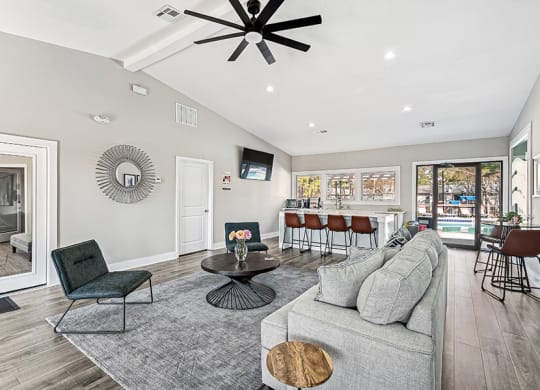 Community Clubhouse with Lounge Furniture and Kitchenette Area at Paramont Apartments in Duluth, GA.
