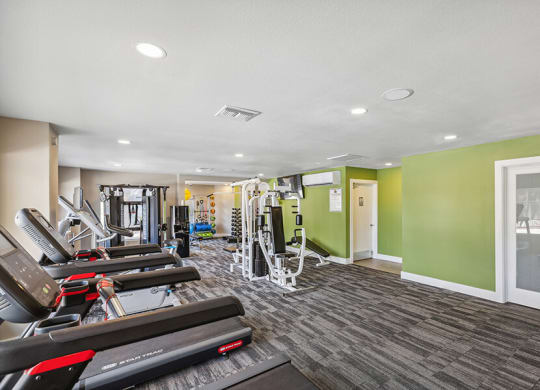 Community Fitness Center with Equipment at Saddle Ridge Apartments in Tucson, AZ.