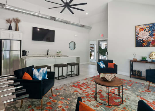 Community Clubhouse with Lounge Furniture and Kitchenette Area at Overlook Apartments located in Salt Lake City, UT.