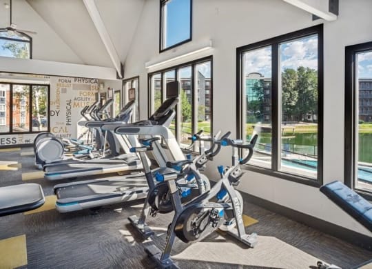 Fitness center with large windows at Esprit Cherry Creek, Glendale Colorado