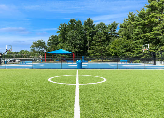 Community Soccer Field and Sports Court at Village at Marshfield Apartments located in Marshfield, MA.