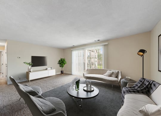 Model Living Room with Carpet and Patio Accessibility at Meadows at Marlborough Apartments in Boston, MA.