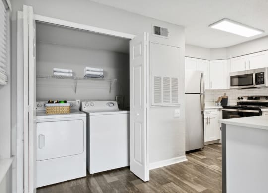 Model laundry closet near kitchen