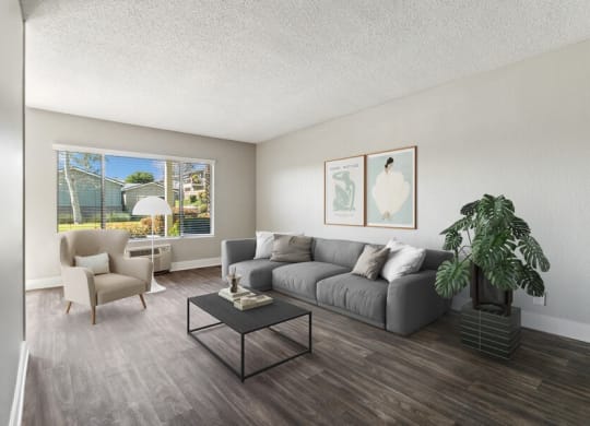 Model Living Room with Wood-Style Flooring & Window View at Forest Park Apartments in El Cajon, CA.