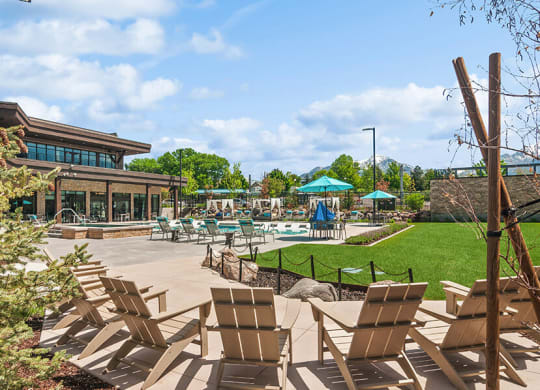 Outdoor Picnic Area with Lounge Furniture and View of Swimming Pool at Seven Skies Apartments located in Sandy, UT.