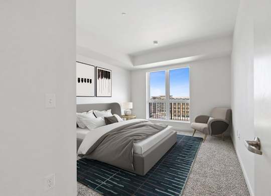 Model bedroom with walk-out balcony