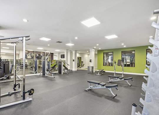Community Fitness Center with Equipment at Madison Park Apartments located in Anaheim, CA.