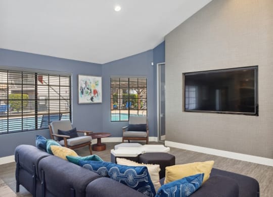 Community Clubhouse with Lounge Furniture and TV at Creek 2645 Apartments in Sacramento, CA.