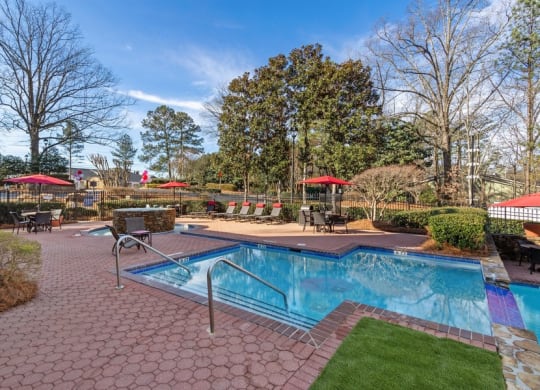 Community pool and custom paver sundeck