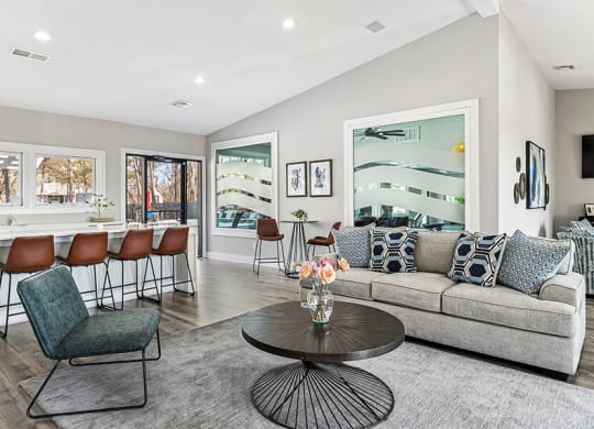 Community Clubhouse with Lounge Furniture and Kitchenette Area at Paramont Apartments in Duluth, GA.