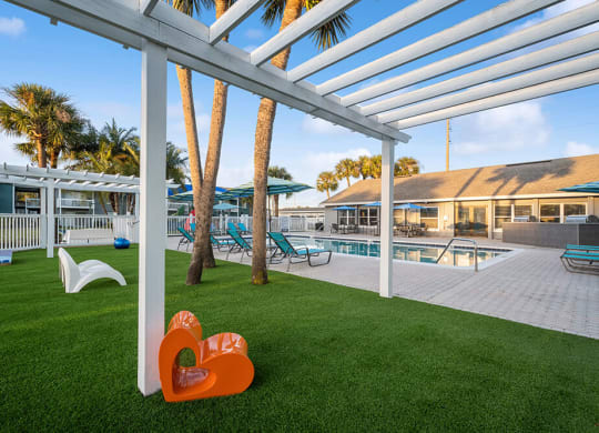 Outdoor Lounge Area with Covered Furniture at Park at 7200 Apartments in Jacksonville, FL.