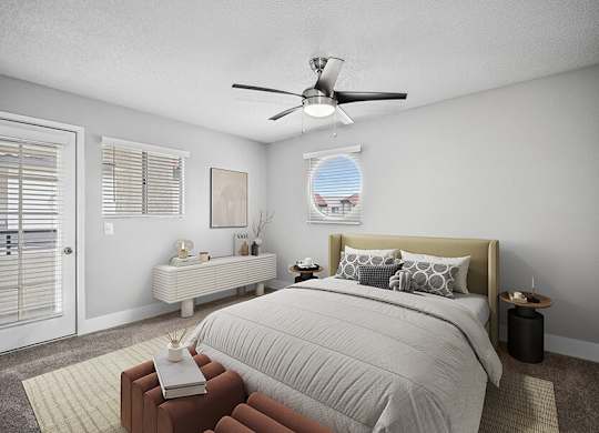 Model Bedroom with Carpet and Patio Accessibility at Stillwater Apartments located in Glendale, AZ.