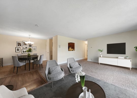 Model Living Room and Dining Room Area with Carpet at Meadows at Marlborough Apartments in Boston, MA.