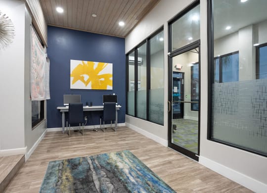 Community Clubhouse Work Station Area at Haven at Water's Edge Apartments in Tampa, FL.