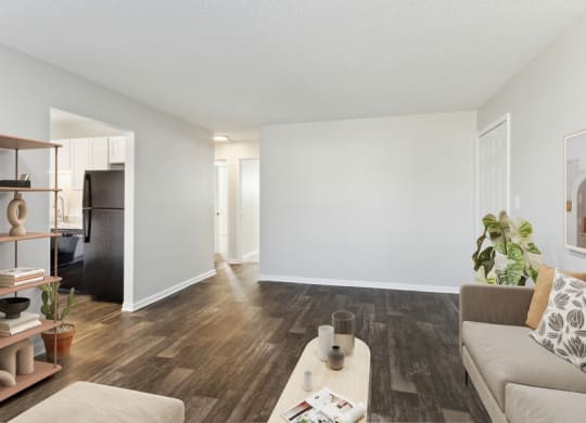 Model living room with view of kitchen