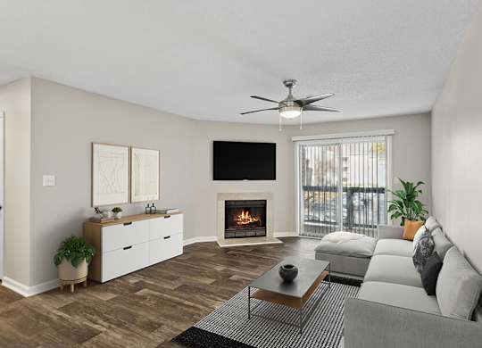 Model Living Room with Wood-Style Flooring, Fireplace and Patio Accessibility at Element 41 Apartments located in Marietta, GA.
