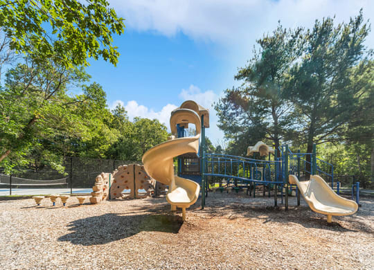 Community Playground with a Slide and Climb Wall at The Commons at Haynes Farm Apartments in Boston, MA.