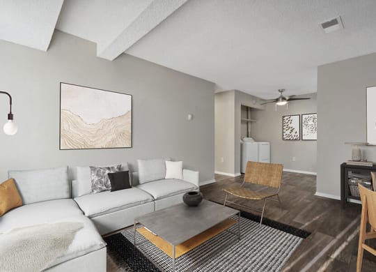 Model Living Room with Wood-Style Flooring at Liberty Creek Apartments in Aurora, CO.