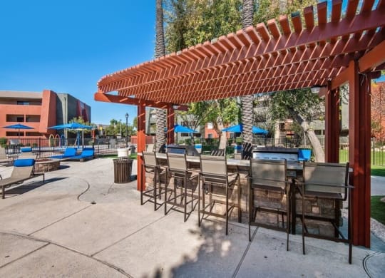 Poolside bbq area with picnic seating at Saratoga Ridge, Phoenix, 85022