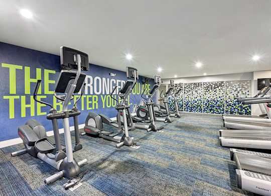 Community Fitness Center with Equipment at Dulles Green Apartments located in Herndon, VA.