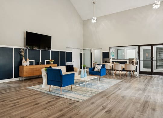 Community Clubhouse with Lounge Furniture and TV at Park 2300 Apartments in Charlotte, NC.