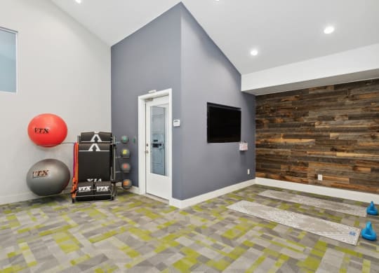 Community Fitness Center with Equipment and Yoga/Meditation Area at Creek 2645 Apartments in Sacramento, CA.