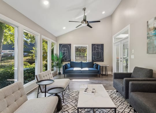 Community Clubhouse with Lounge Furniture at Lakeside Retreat Apartments located in Peachtree Corners, GA.